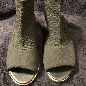 Women’s black wedge sandals.